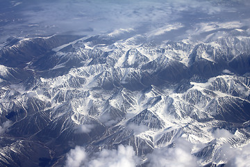 Image showing Pattern of snow, clouds and stones: view from height.