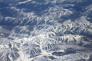 Image showing Pattern of snow, clouds and stones: view from height.