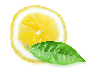 Image showing Slice of yellow lemon and green leaf