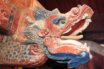 Image showing Ancient wood carving art of dragon