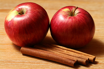 Image showing Two apples with cinnamon