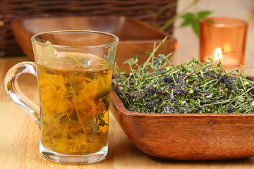 Image showing Herbs in glass and bowl