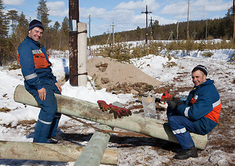 Image showing Young workers electricians. Outage