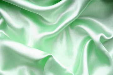 Image showing Smooth elegant green silk as background