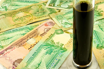 Image showing Oil and money