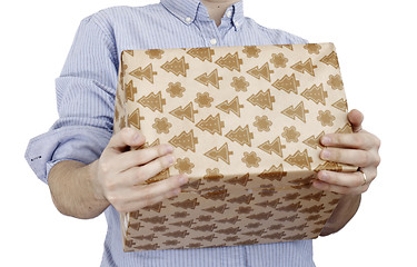 Image showing Young man holding a present