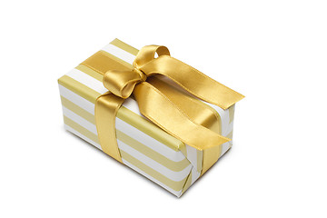 Image showing Gift box in gold duo tone with golden satin ribbon and bow isolated over white background.
