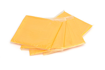 Image showing cheddar cheese slices on white background