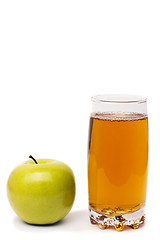 Image showing glass of apple juice and green apples isolated on white