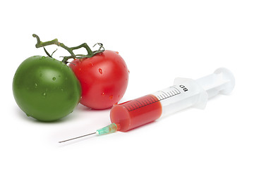 Image showing syringe and green with red tomatoes