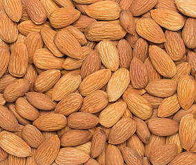 Image showing Pile of almonds close-up as background.