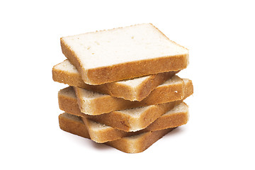 Image showing A pile of nine toasted bread slices for breakfast isolated on white studio background.