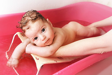 Image showing baby is having a bath