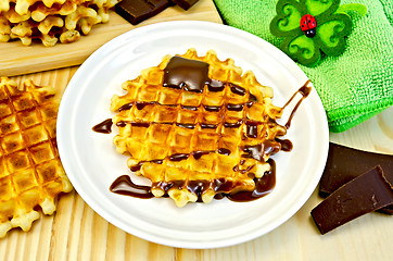 Image showing Waffles circle with chocolate and green napkin