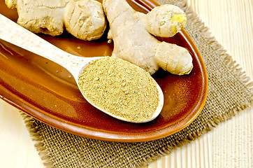 Image showing Ginger fresh and dried on a clay plate and burlap