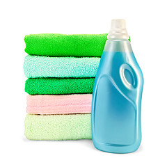 Image showing Fabric softener the bottle and a stack of towels