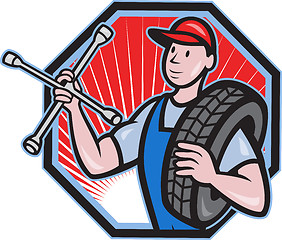 Image showing Mechanic With Tire Socket Wrench And Tire