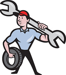 Image showing Mechanic With Tire Socket Wrench And Tire