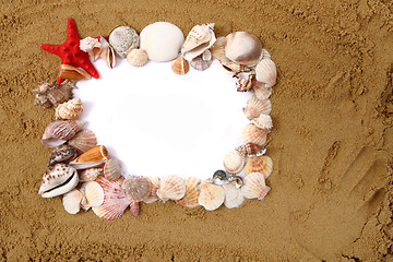 Image showing sea shells, paper and yellow sand