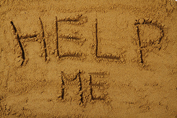 Image showing help me in the sand