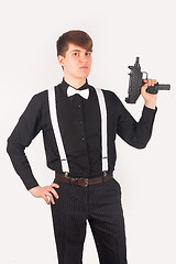 Image showing Young gangster with a gun