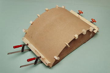 Image showing Gluing the arch of hardboard with the use of  forms