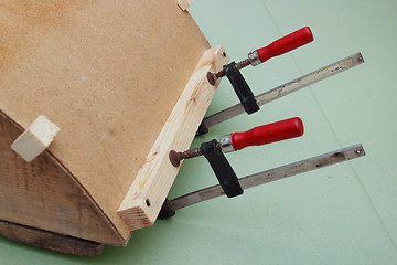 Image showing Clamps are used for gluing  workpiece