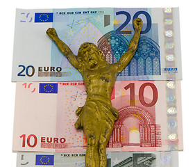 Image showing concept gold jesus crucify euro cash banknotes 
