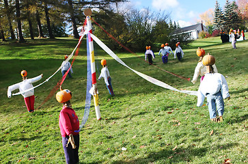 Image showing Pumpkin people maypole.