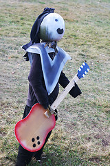 Image showing Pumpkin guitarist rocks