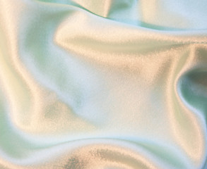 Image showing Smooth elegant silvery green silk as background