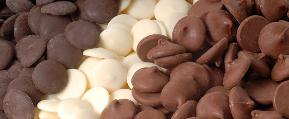 Image showing Three types of chocolate chips, dark, white and semi-sweet