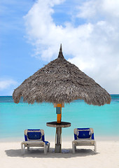 Image showing Thatched hut on a white sand beach in Aruba