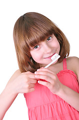 Image showing girl brushing her teeth with a toothbrush