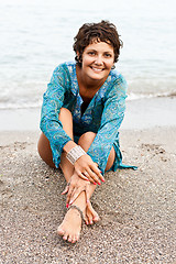 Image showing woman in blue dress on the beach