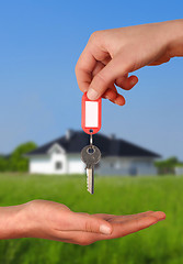 Image showing Hands with Key to New House