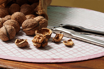 Image showing Walnuts and Nutcracker on Table