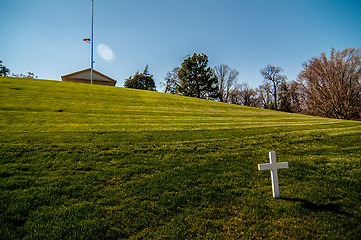 Image showing white cross on a grassy hill