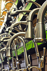 Image showing rows of faucets on display for sale at store