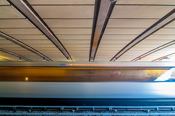 Image showing metro train moving by at the station