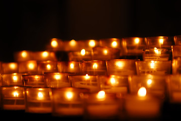 Image showing Charity. Lignting of Praying candles in a temple.