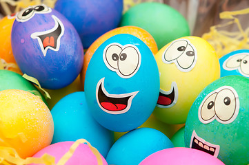 Image showing smiley easter eggs in a holiday basket arrangement