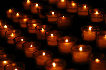 Image showing Charity. Lignting of Praying candles in a temple.