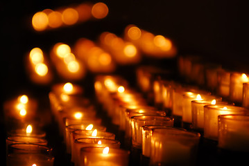 Image showing Charity. Lignting of Praying candles in a temple.