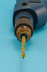 Image showing old electric drill golden bit closeup 