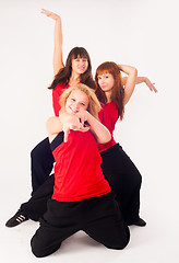 Image showing Three pretty girls dancing