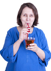 Image showing elderly woman drinks juice