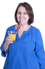 Image showing elderly woman drinks orange juice