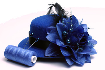 Image showing Blue hat and coil of threads