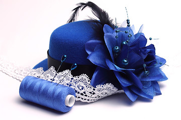 Image showing Blue hat and white lace